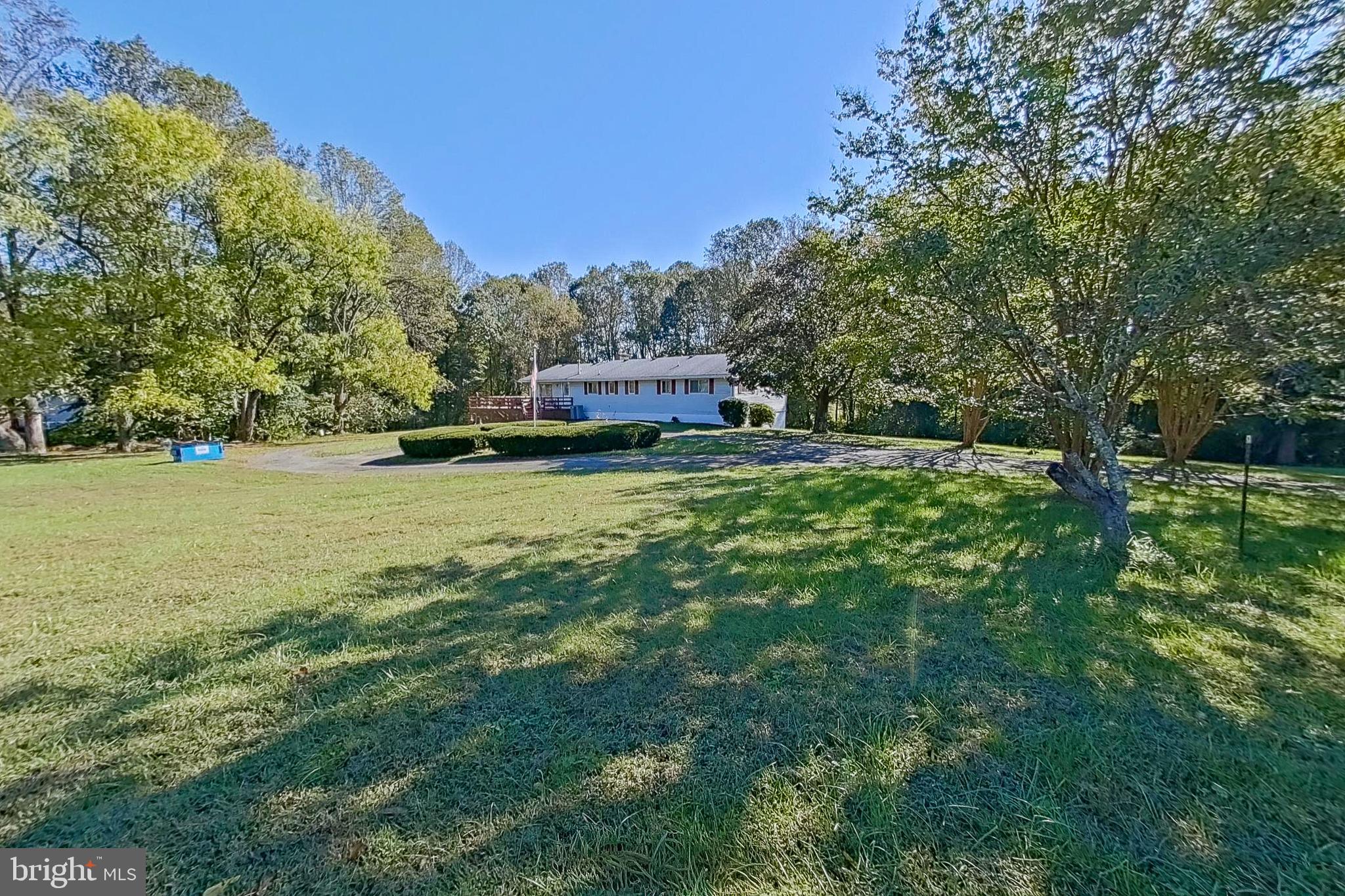 300 Armiger Road Huntingtown, MD 20639 - Photo 1 of 46 a swimming pool with trees in the background
