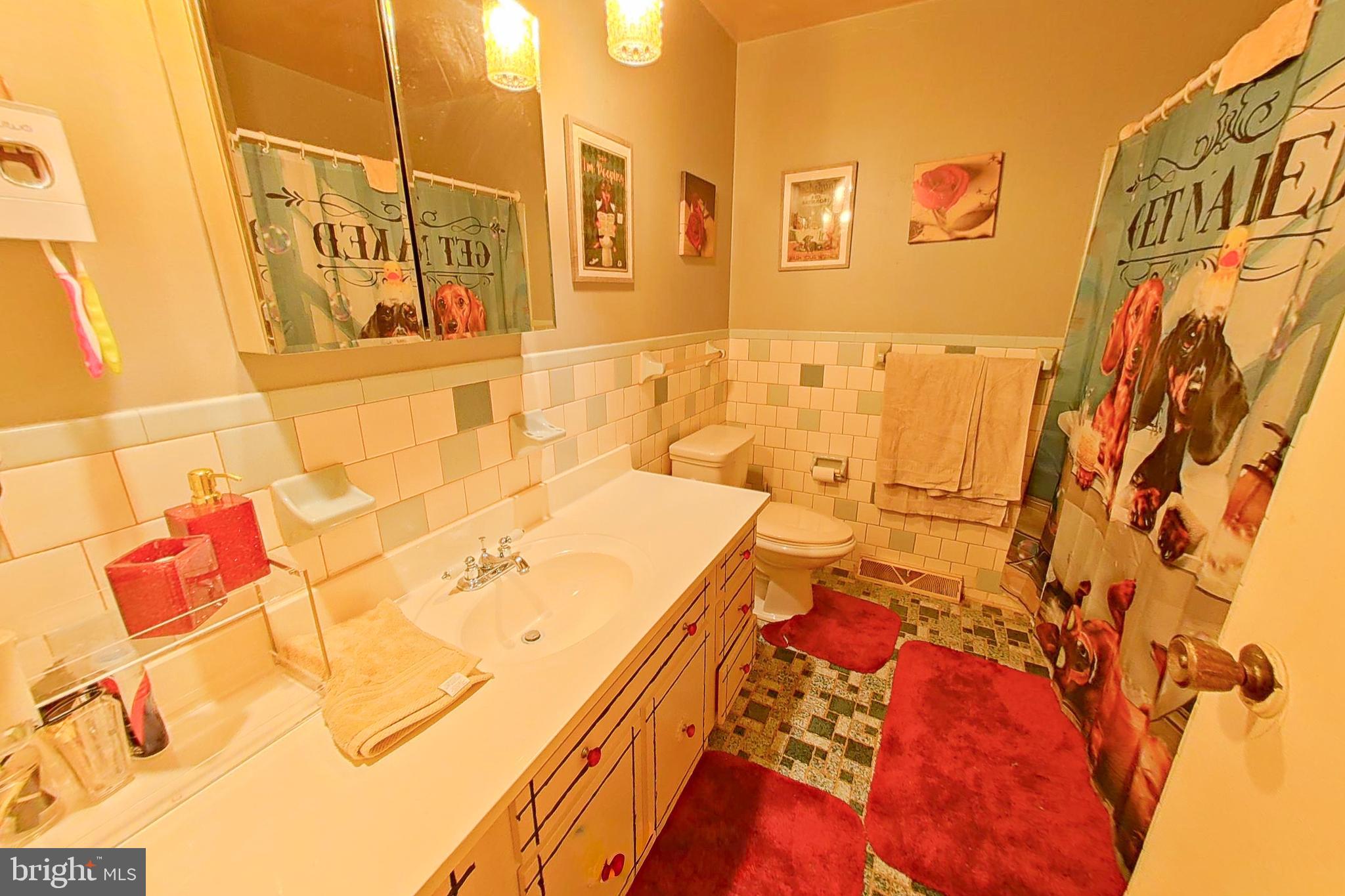 300 Armiger Road Huntingtown, MD 20639 - Photo 19 of 46 a bathroom with a bathtub and shower
