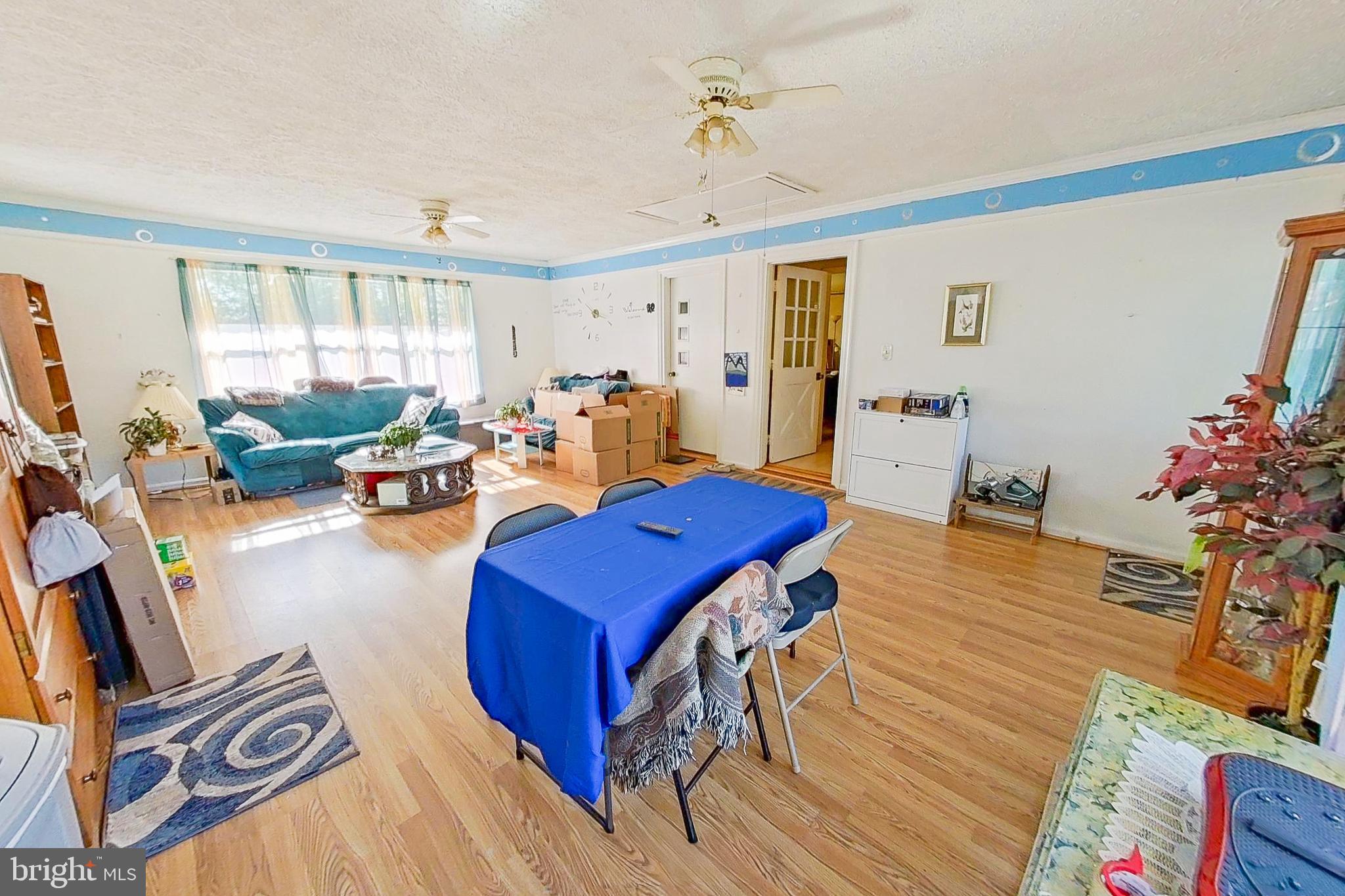 300 Armiger Road Huntingtown, MD 20639 - Photo 7 of 46 a living room with furniture and wooden floor