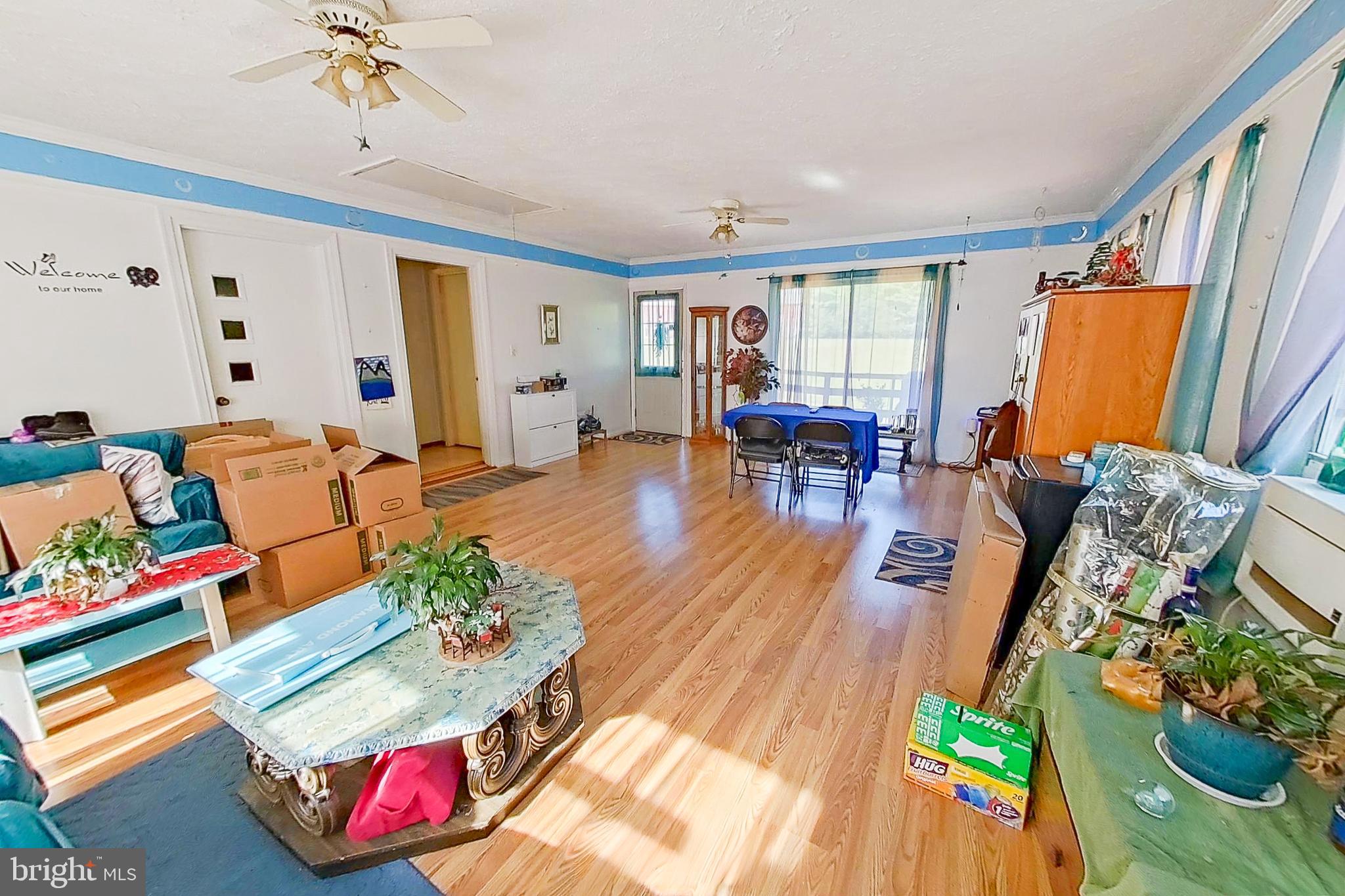 300 Armiger Road Huntingtown, MD 20639 - Photo 8 of 46 a living room with furniture and a wooden floor