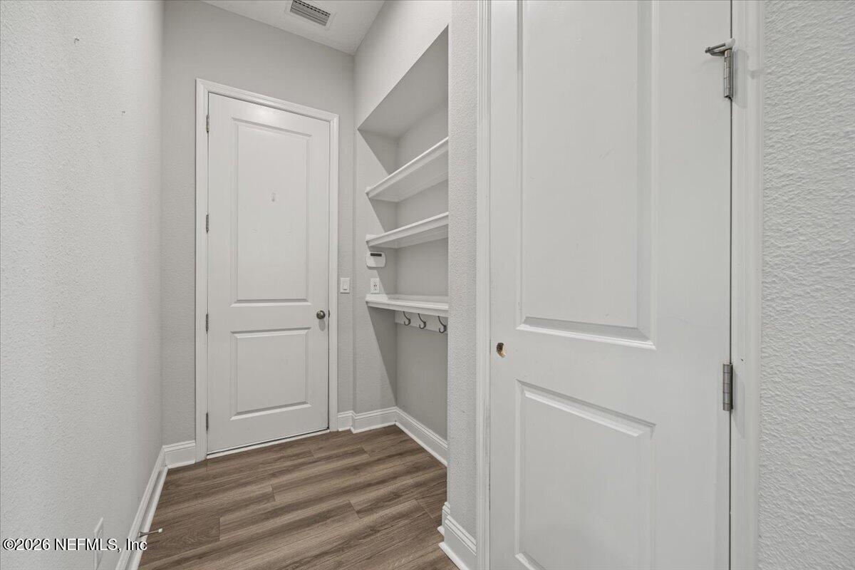317 Oak Shadow Place St. Johns, FL 32259 - Photo 23 of 62 Hall to garage