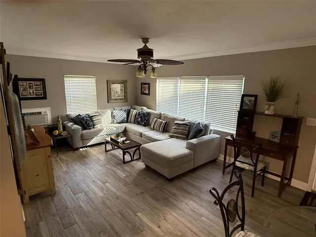 a living room with furniture and a window