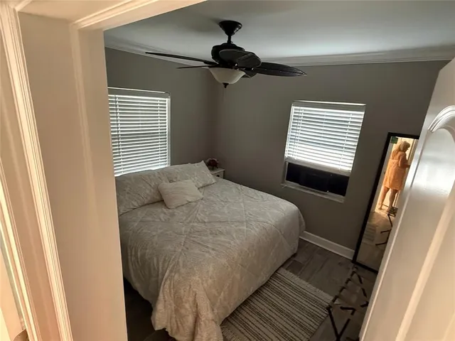 a bedroom with a bed and a walk in closet