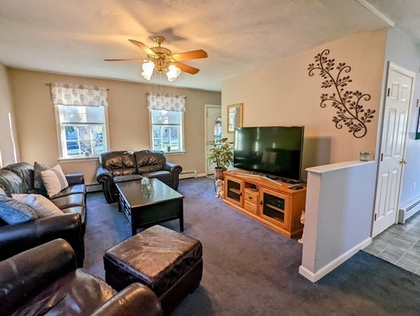 26 El Caney Road Worcester, MA 01603 - Photo 22 of 37 a living room with furniture and a flat screen tv