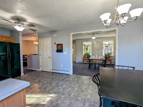 26 El Caney Road Worcester, MA 01603 - Photo 25 of 37 a view of a livingroom kitchen and dining room