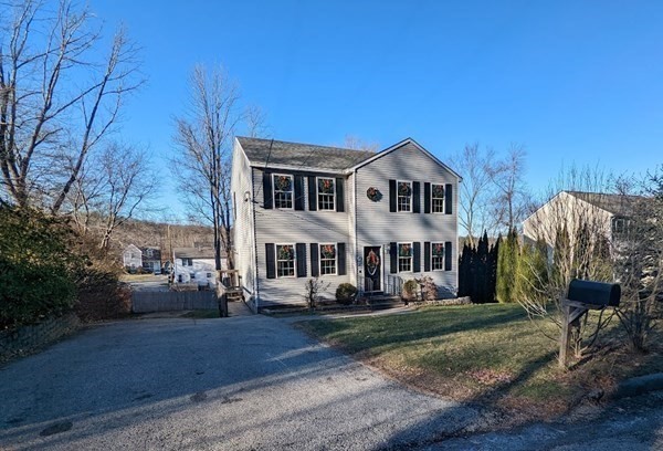 26 El Caney Road Worcester, MA 01603 - Photo 32 of 37 a front view of a house with garden
