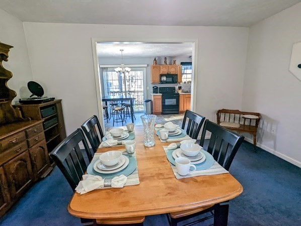 26 El Caney Road Worcester, MA 01603 - Photo 9 of 37 a dining room with furniture and wooden floor