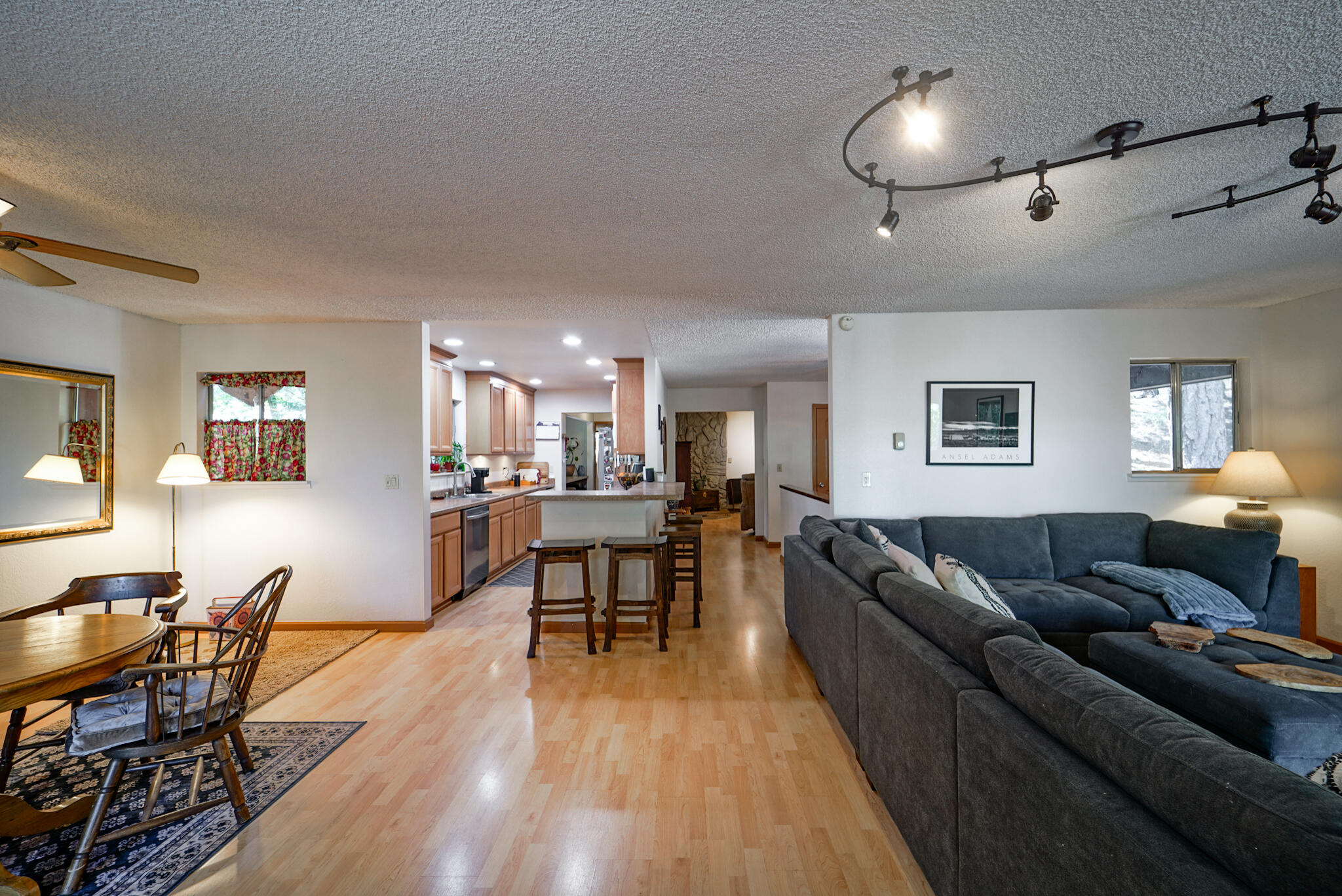500 Timber Ridge Road Weaverville, CA 96093 - Photo 19 of 61 a living room with furniture a dining table and wooden floor