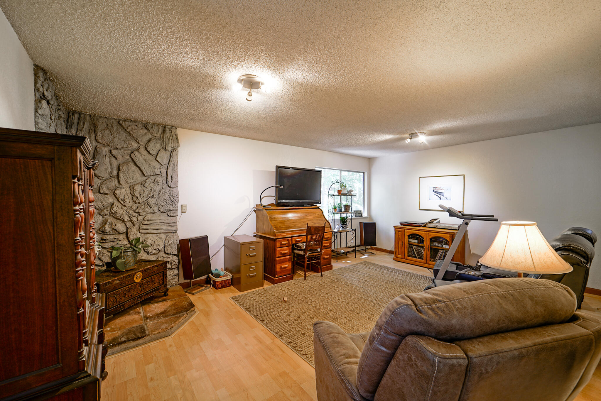 500 Timber Ridge Road Weaverville, CA 96093 - Photo 24 of 61 a bedroom with furniture and a flat screen tv