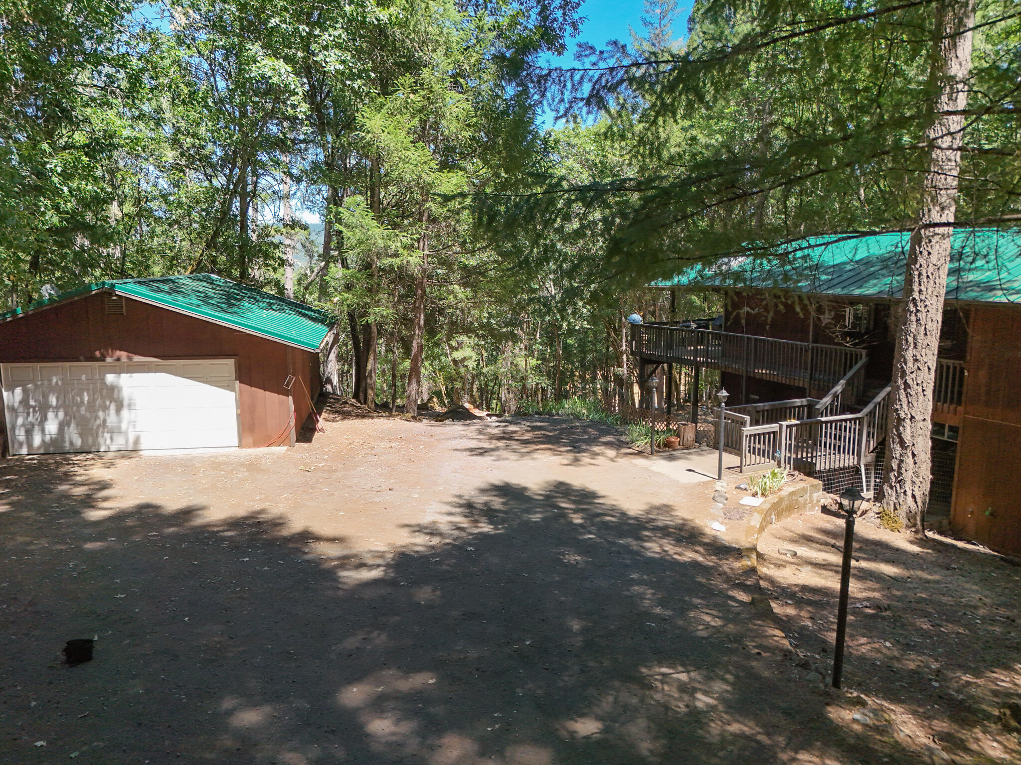 500 Timber Ridge Road Weaverville, CA 96093 - Photo 3 of 61 a backyard of a house with table and chairs