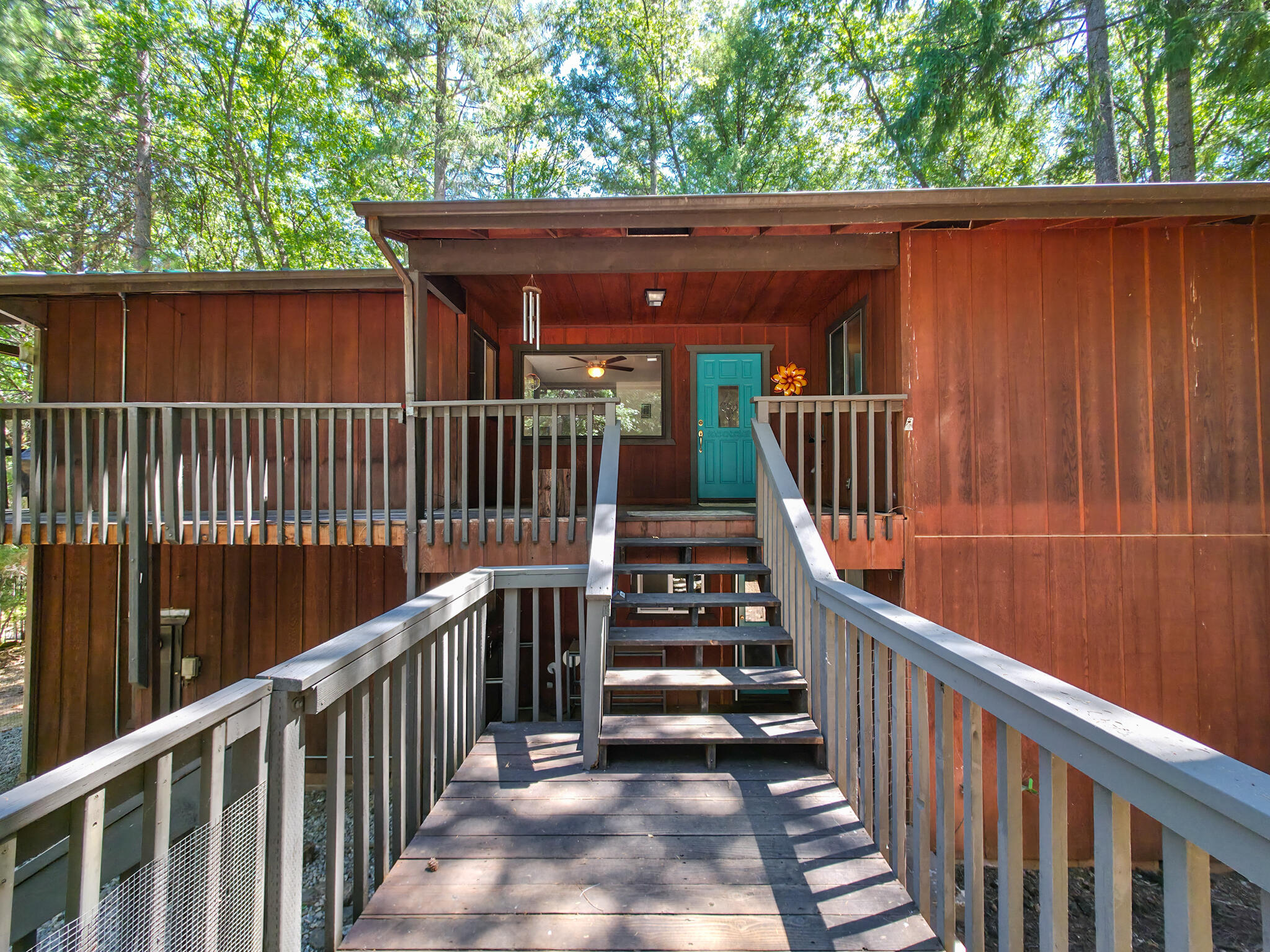 500 Timber Ridge Road Weaverville, CA 96093 - Photo 5 of 61 a view of a wooden deck and a yard
