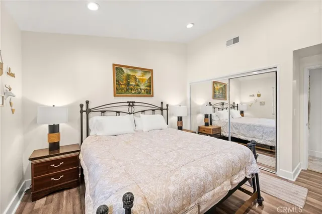 a bedroom with a bed and a view of bathroom