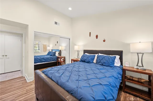 a bed room with a bed and a lamp