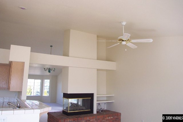 1418 Backer Way Reno, NV 89523 - Photo 6 of 9 a living room with furniture and a mirror