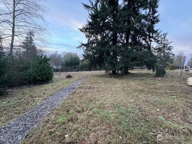 a sign on the wall with a white wall