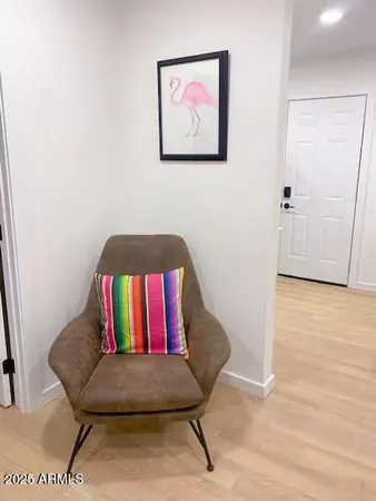 a bedroom with bed and a mirror