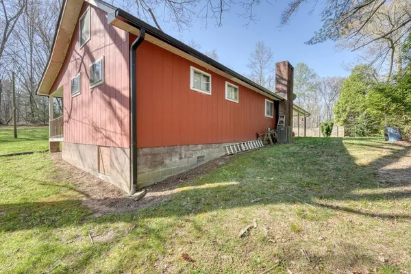 a backyard of a house with wooden fence