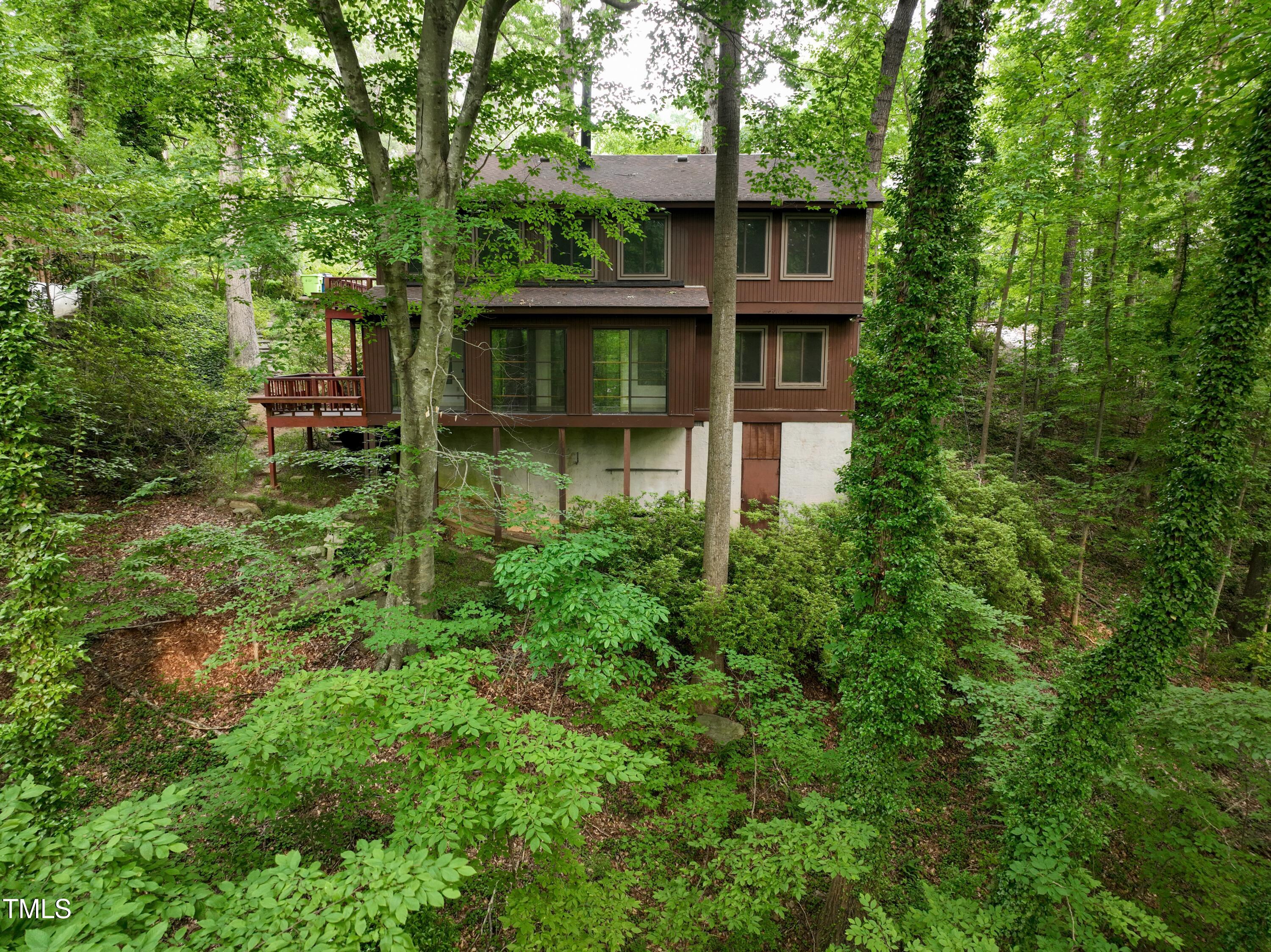 3416 Ocotea Street Raleigh, NC 27607 - Photo 5 of 7 a front view of a house with a garden