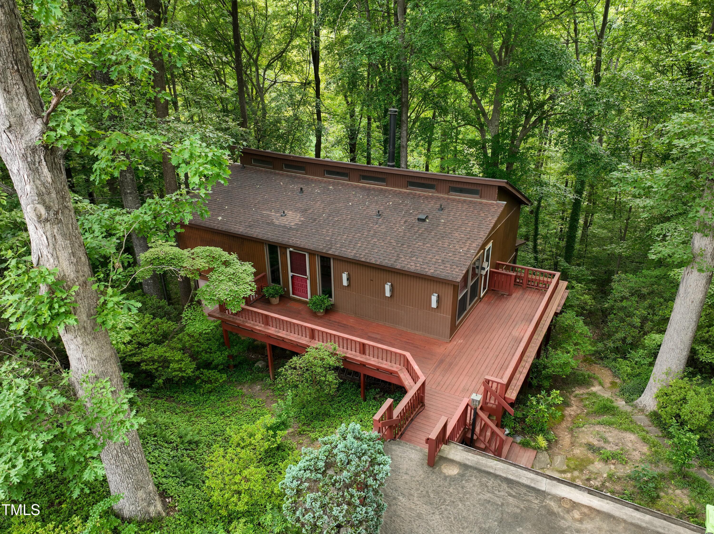3416 Ocotea Street Raleigh, NC 27607 - Photo 6 of 7 an aerial view of a house with yard and outdoor seating