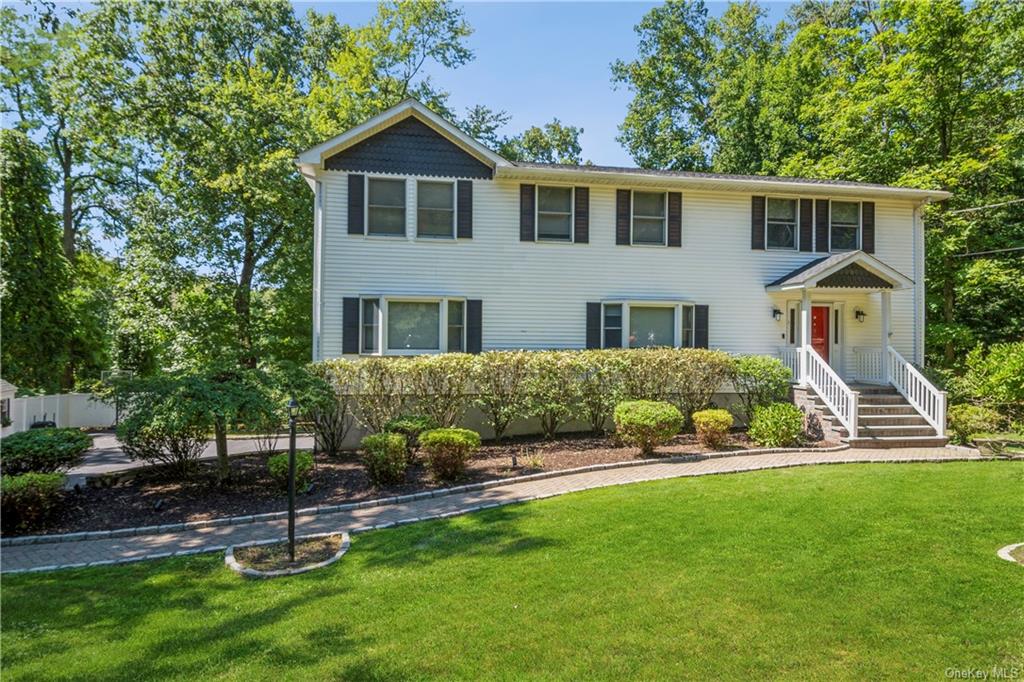 10 Carleton Avenue Briarcliff Manor, NY 10510 - Photo 1 of 34 a front view of a house with a yard and green space