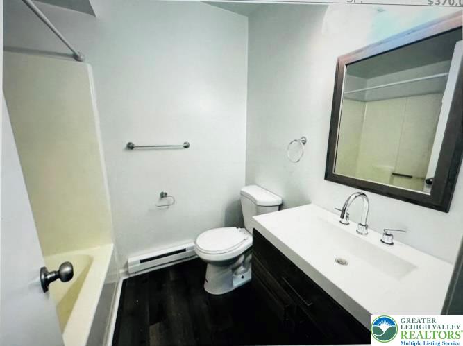 301 North Halstead Street, Unit #1 Allentown, PA 18109 - Photo 11 of 11 a bathroom with a sink a toilet a mirror and vanity