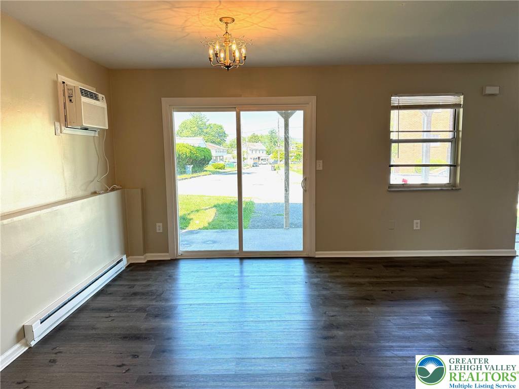 301 North Halstead Street, Unit #1 Allentown, PA 18109 - Photo 4 of 11 a view of an empty room with wooden floor and a window