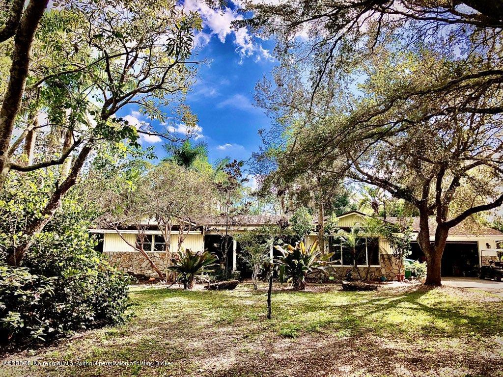 2762 F Road Loxahatchee, FL 33470 - Photo 1 of 25 a view of a park with large trees