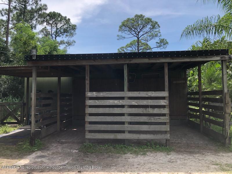 2762 F Road Loxahatchee, FL 33470 - Photo 18 of 25 a view of a porch with a door