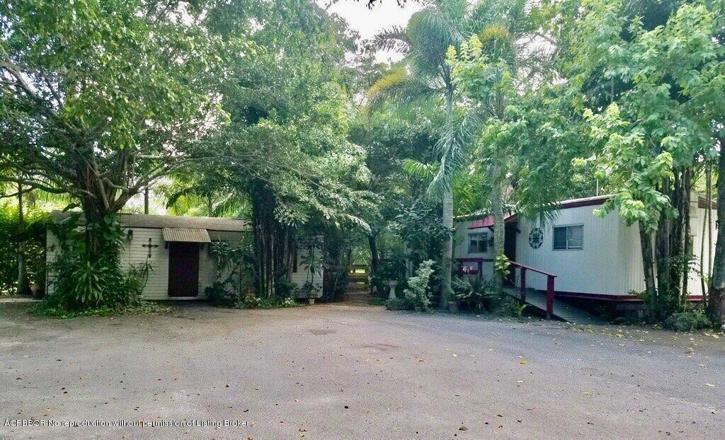 2762 F Road Loxahatchee, FL 33470 - Photo 24 of 25 a house view with a backyard space