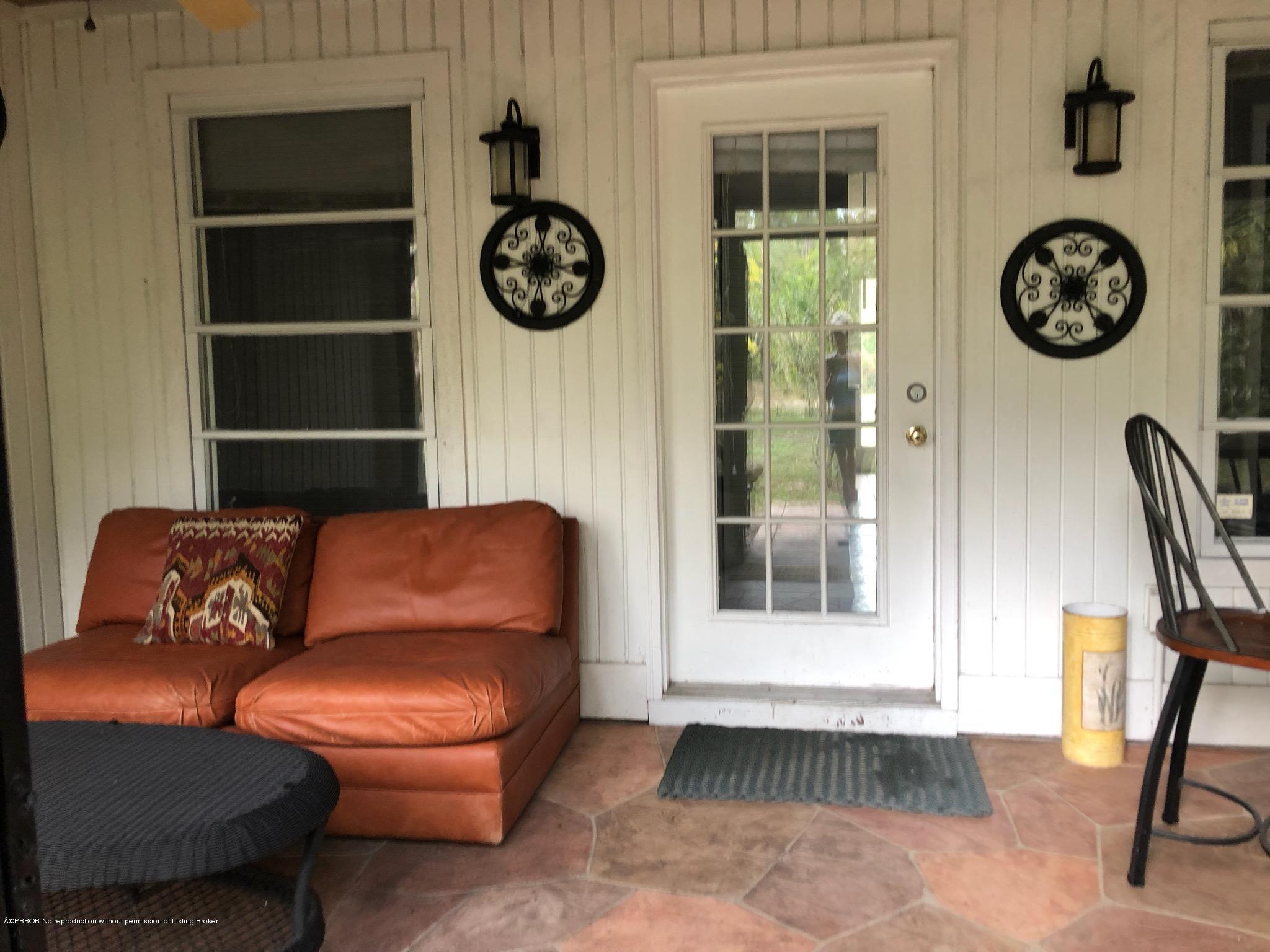 2762 F Road Loxahatchee, FL 33470 - Photo 7 of 25 a living room with furniture and a window