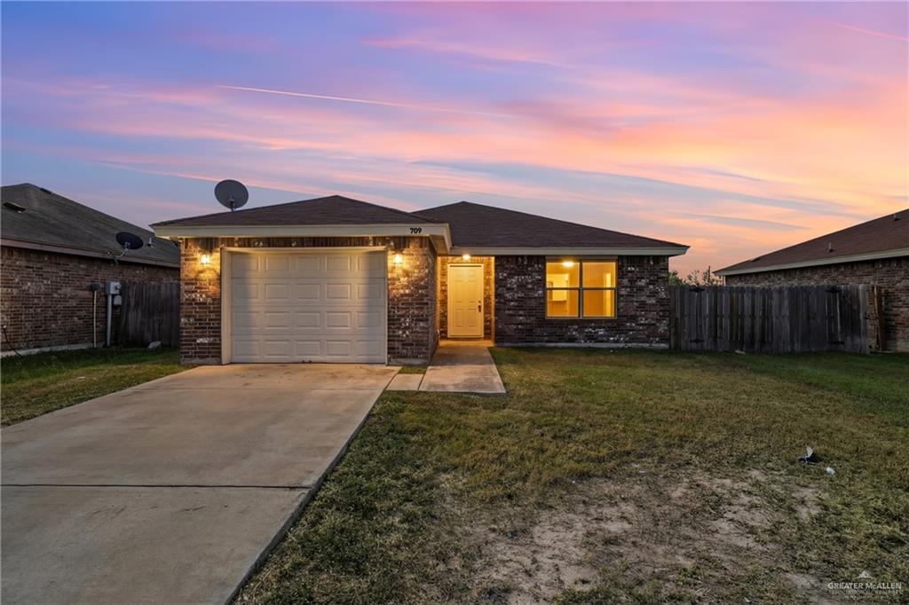 a house view with a garden space