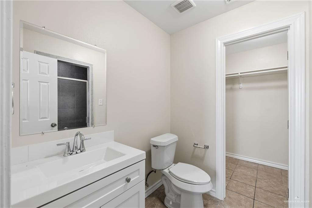 709 Alexandra Avenue Mercedes, TX 78570 - Photo 13 of 16 a bathroom with a sink toilet and vanity