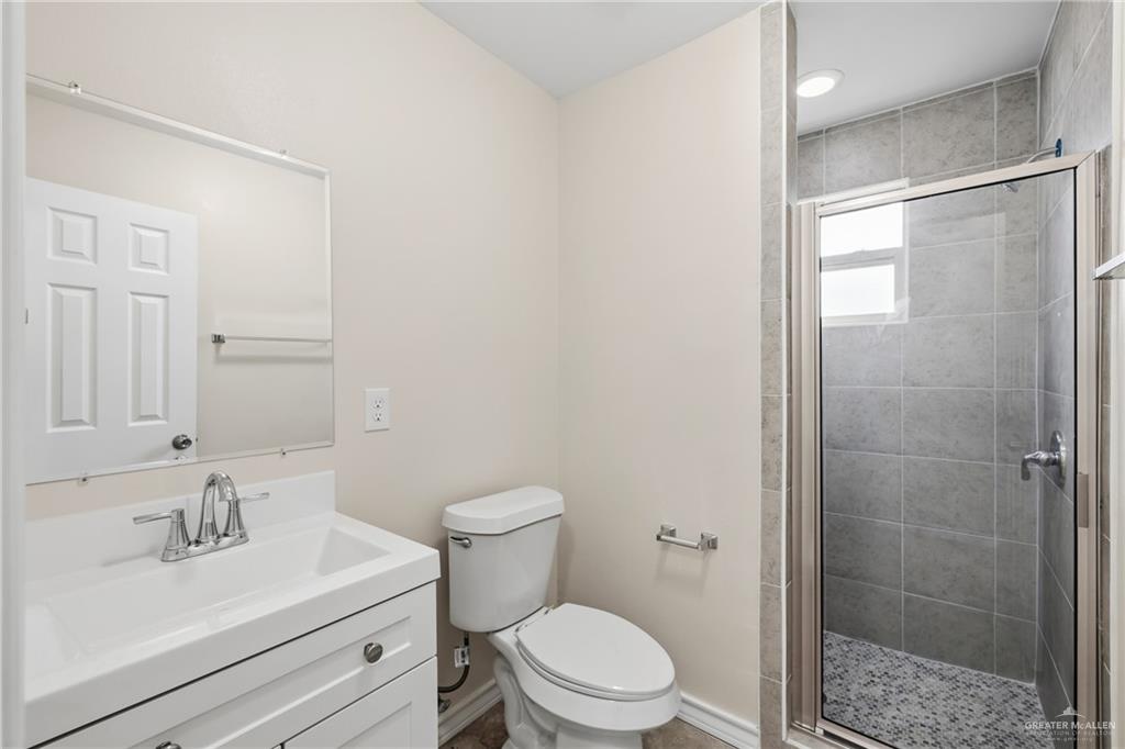 709 Alexandra Avenue Mercedes, TX 78570 - Photo 14 of 16 a bathroom with a sink a toilet and shower