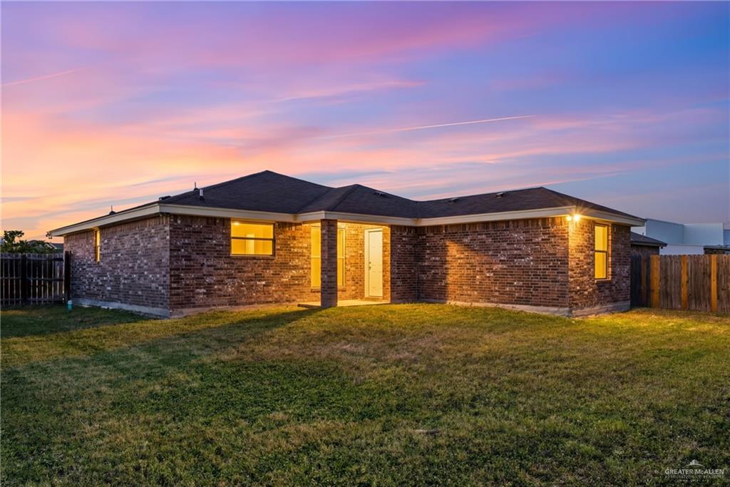 709 Alexandra Avenue Mercedes, TX 78570 - Photo 16 of 16 a view of a yard with a house in the background