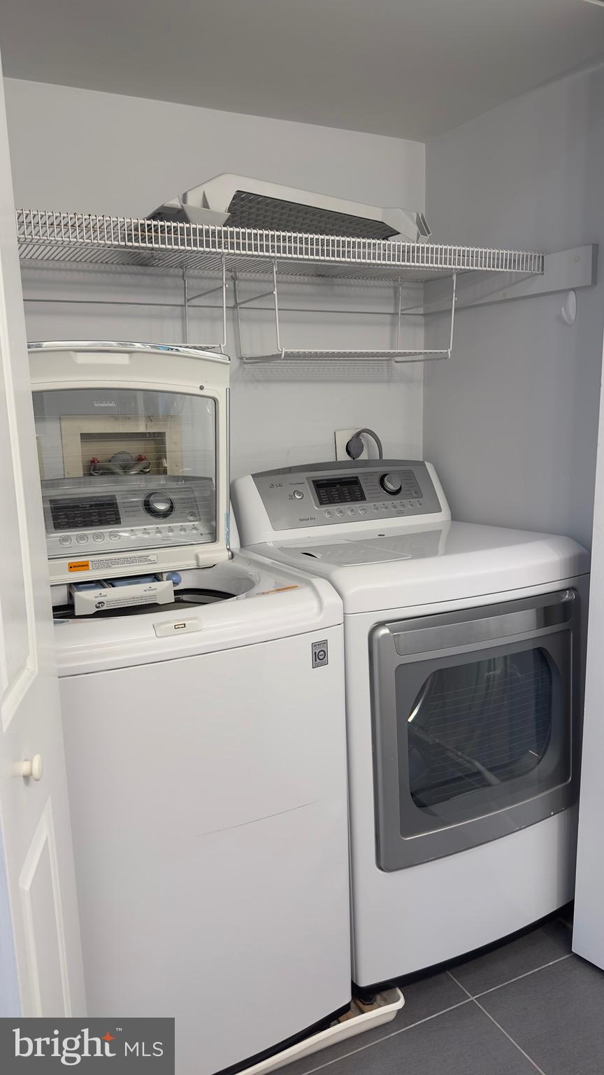 342 Brigade Court, Unit 342 Chesterbrook, PA 19087 - Photo 11 of 16 a utility room with dryer and washer