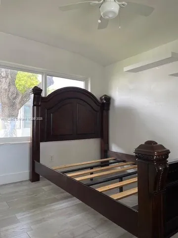 a view of barbeque grill with wooden floor