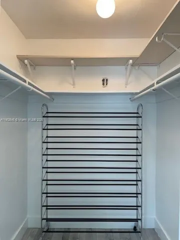 a close view of closet with wooden floor