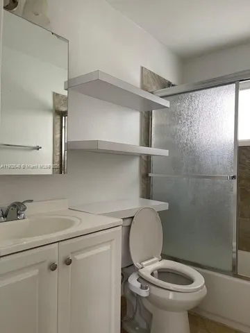 a bathroom with a toilet and a sink