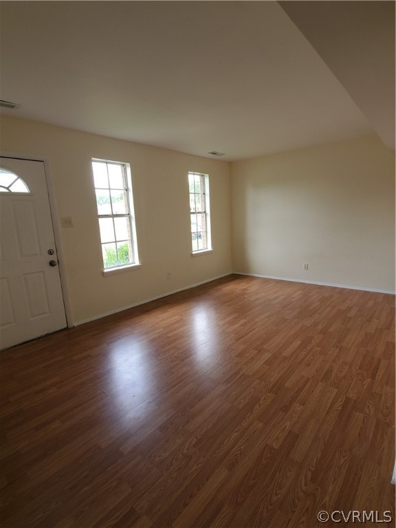 1906 Beaver Road Henrico, VA 23075 - Photo 2 of 13 an empty room with wooden floor and windows