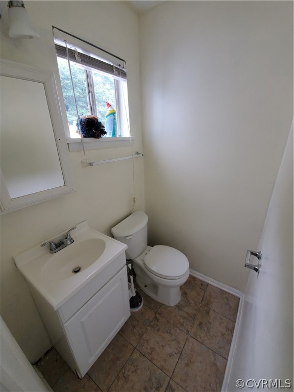 1906 Beaver Road Henrico, VA 23075 - Photo 5 of 13 a white toilet sitting next to a bathroom sink