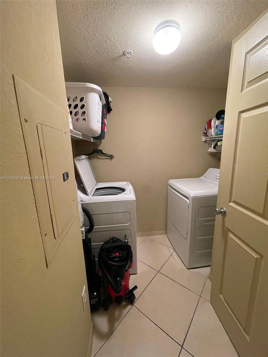 6830 West Sample Road, Unit 6830 Coral Springs, FL 33067 - Photo 21 of 30 a utility room with dryer and washer