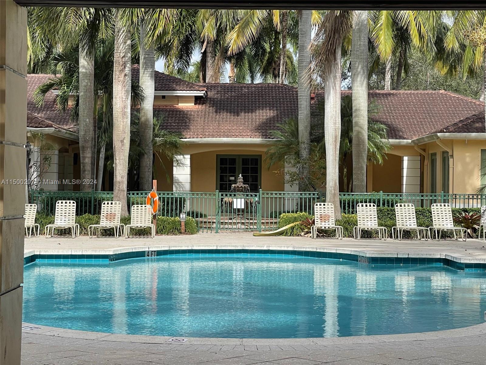 6830 West Sample Road, Unit 6830 Coral Springs, FL 33067 - Photo 25 of 30 a house view with outdoor space swimming pool and outdoor space