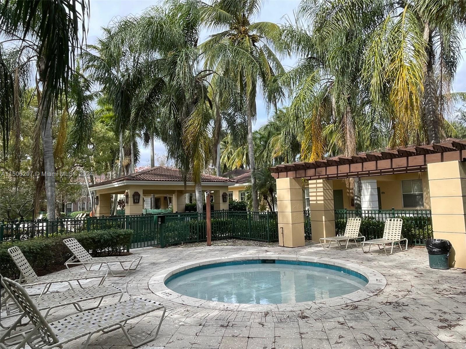 6830 West Sample Road, Unit 6830 Coral Springs, FL 33067 - Photo 28 of 30 a view of outdoor space yard swimming pool and patio