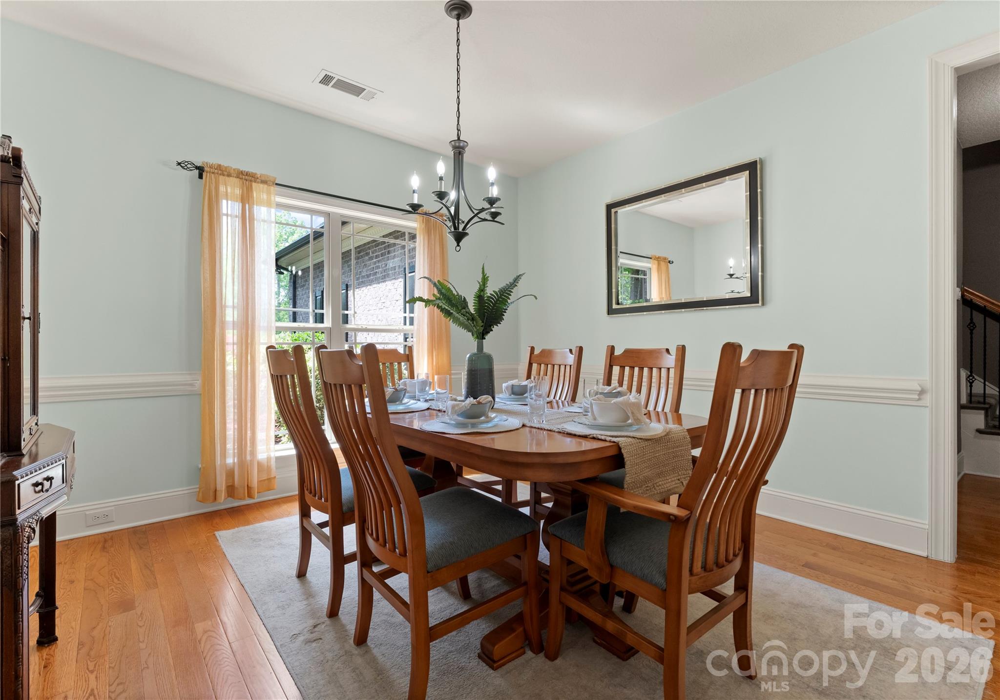 860 Arrow Point Lane Kannapolis, NC 28081 - Photo 12 of 38 a view of a dining room with furniture window and wooden floor