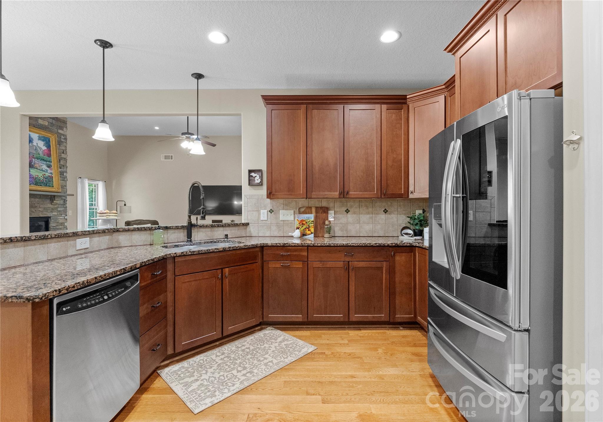 860 Arrow Point Lane Kannapolis, NC 28081 - Photo 13 of 38 a kitchen with stainless steel appliances granite countertop a refrigerator a stove and a sink