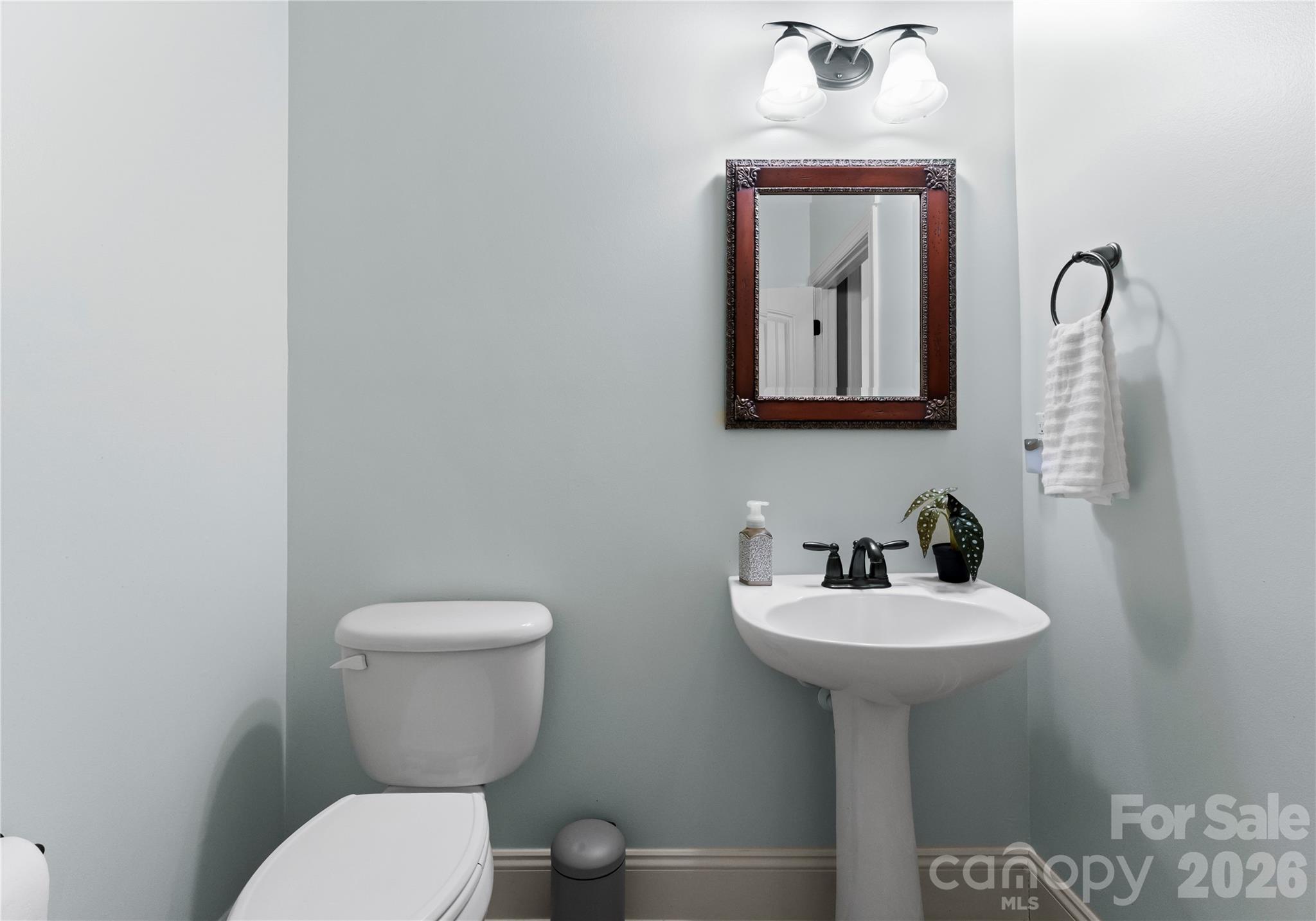 860 Arrow Point Lane Kannapolis, NC 28081 - Photo 17 of 38 a bathroom with a toilet sink and mirror