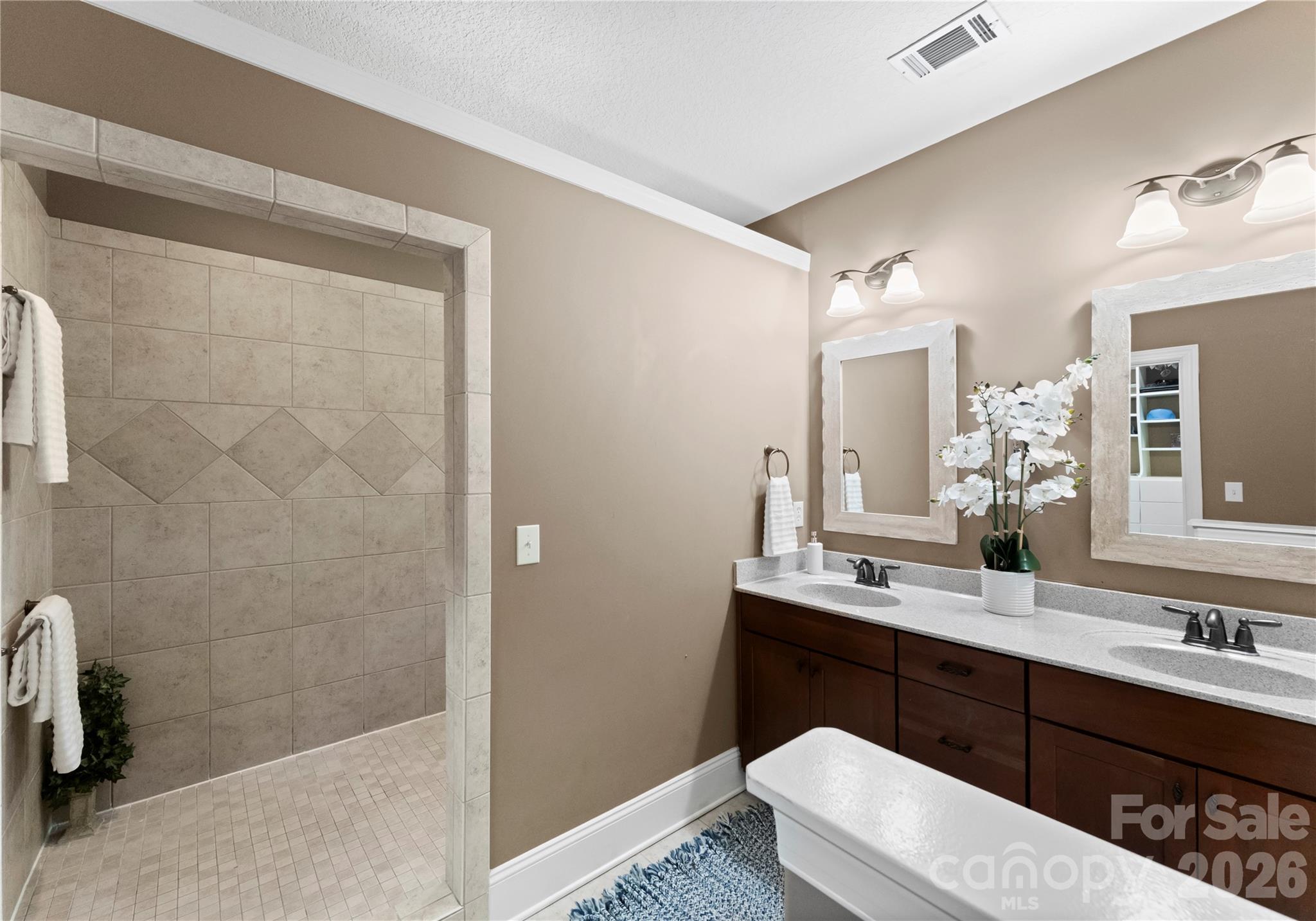 860 Arrow Point Lane Kannapolis, NC 28081 - Photo 20 of 38 a bathroom with a sink a toilet a mirror and shower