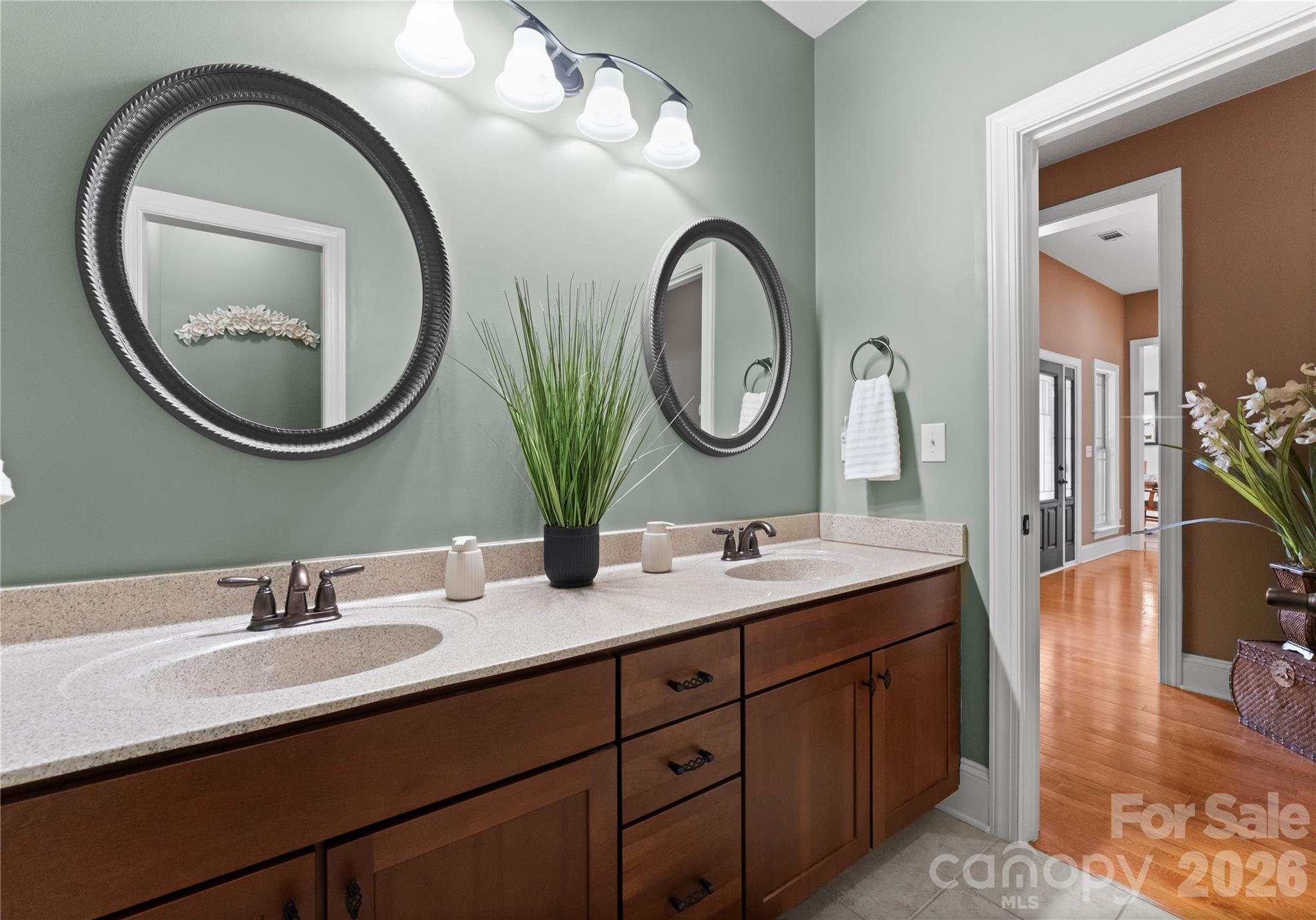 860 Arrow Point Lane Kannapolis, NC 28081 - Photo 24 of 38 a bathroom with a granite countertop double vanity sinks and a mirror