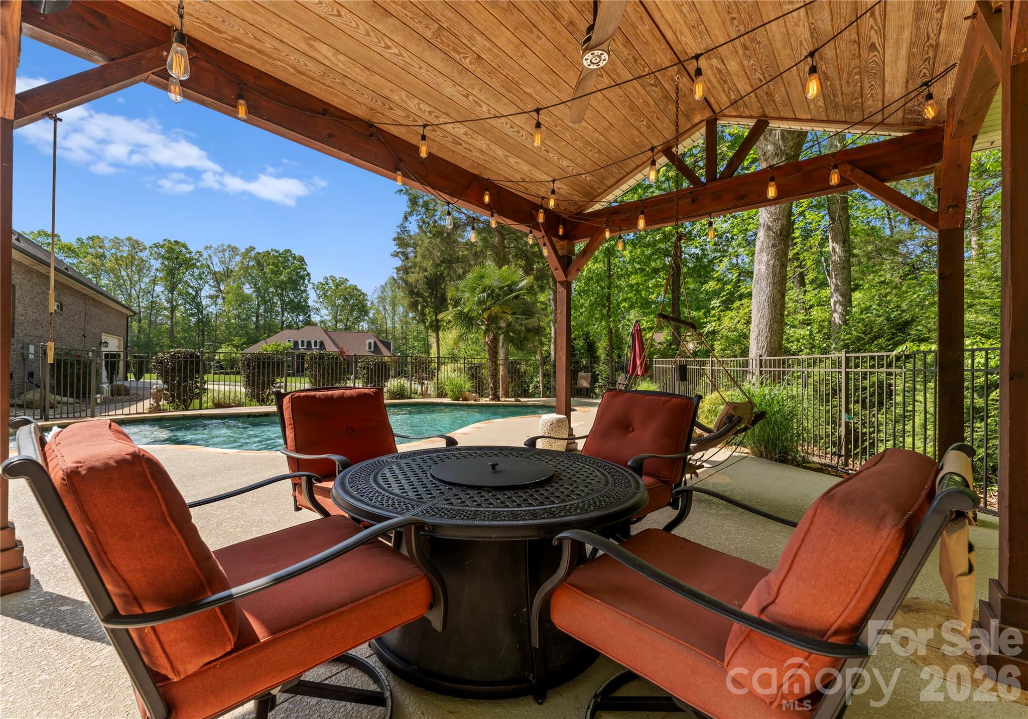 860 Arrow Point Lane Kannapolis, NC 28081 - Photo 33 of 38 a view of a patio with a table chairs and a fire pit