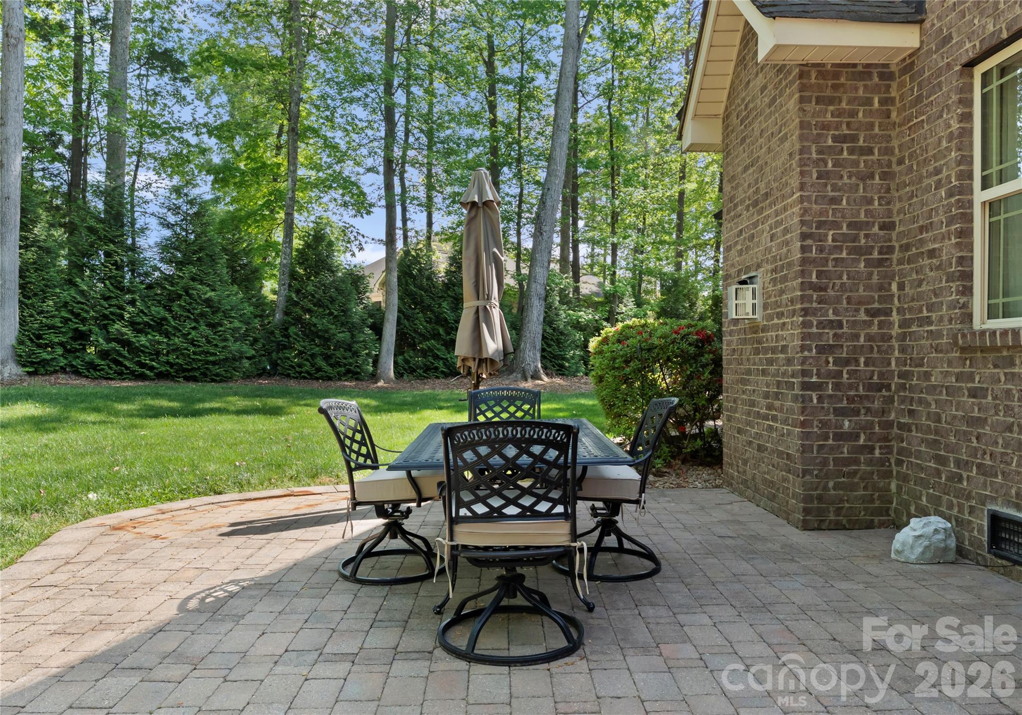860 Arrow Point Lane Kannapolis, NC 28081 - Photo 36 of 38 a view of a chairs and table in backyard of the house